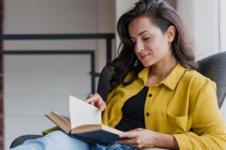 A woman reading a book that boosts confidence and inspires personal growth
