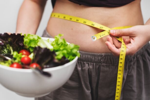 woman measuring her tummy for weight loss