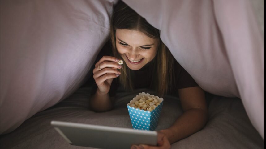 Cheerful woman watching a movie